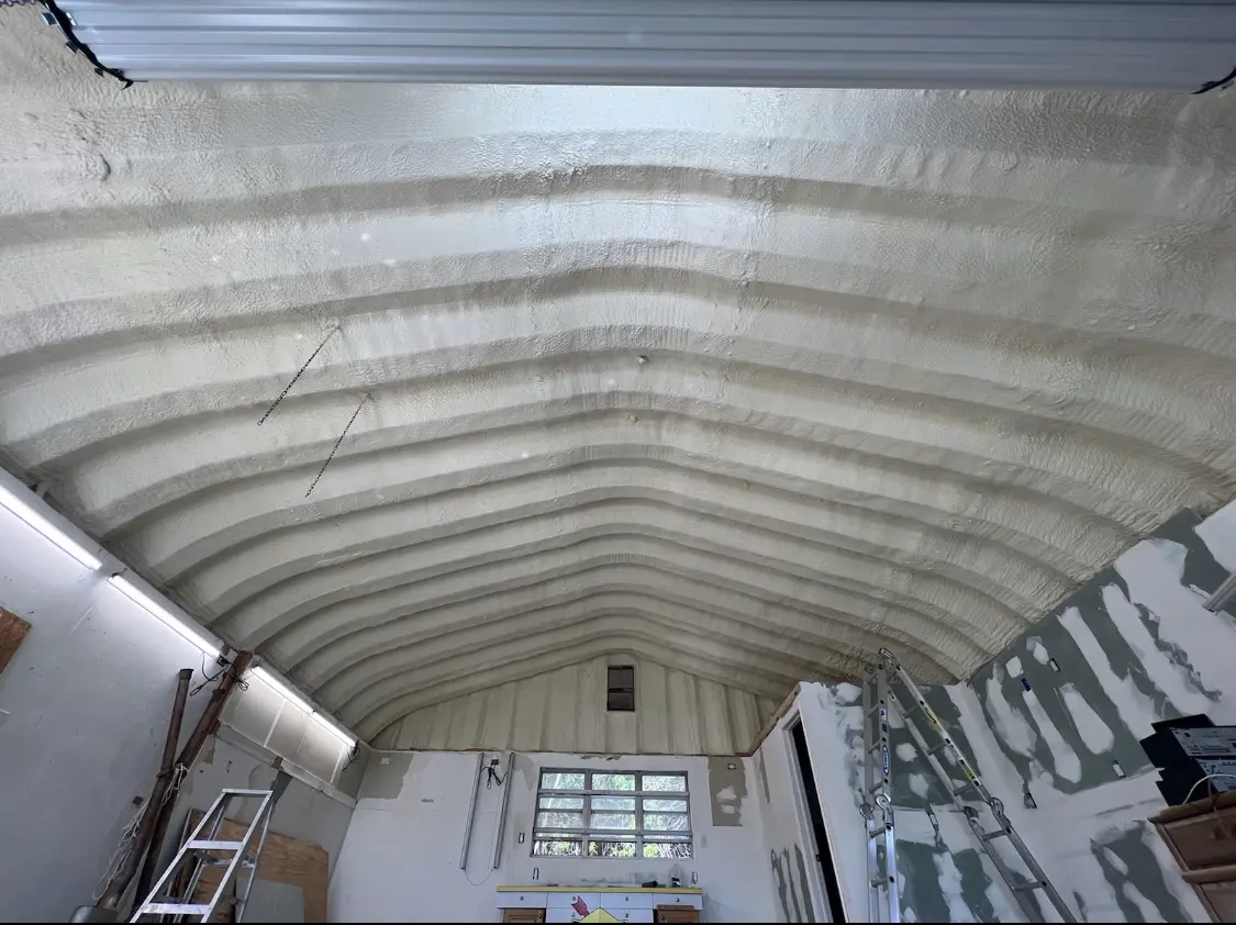 Spray polyurethane foam applied to the underside of a metal roof deck in Westport